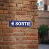 Panneau signalétique Sortie à gauche – sécurité bâtiment