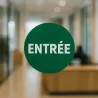 Vinyle adhésif personnalisé rond, collé sur la porte vitrée d'un hall d'entreprise