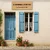 Panneau bois chambres d’hôtes posé sur une façade